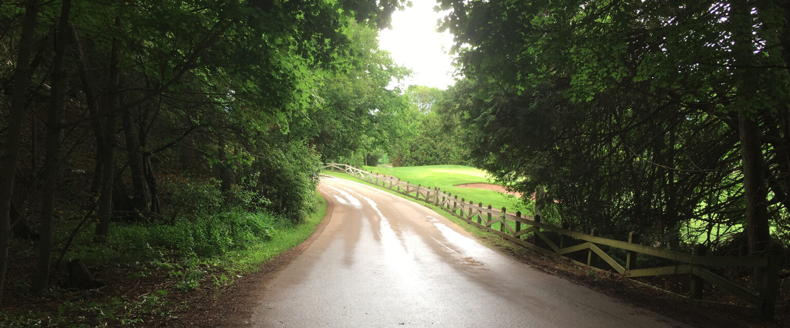 A small dirt road on Mackinac Island, Michigan, USA. At the top of the hill beside the Grand Hotel.