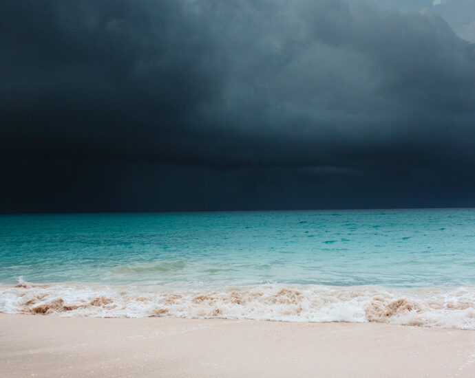 A tropical storm is coming across the crystaline-blue ocean in Barbados.