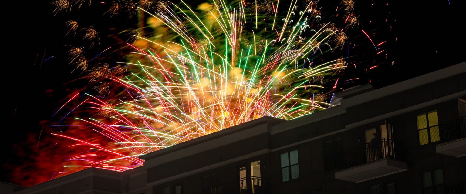 Fourth of July fireworks over an apartment building near Sandy Springs.