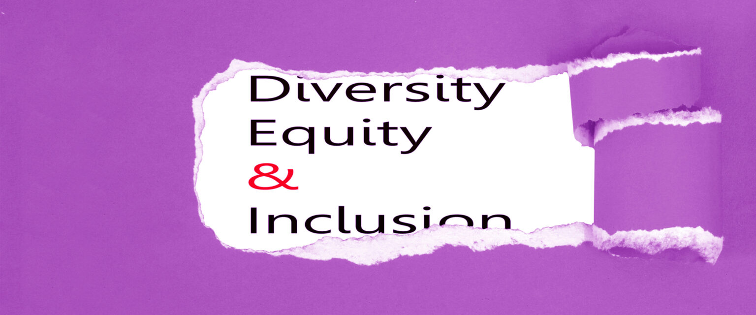 The words "Diversity, Equity, & Inclusion" are revealed on white paper, behind torn and peeled purple paper in the foreground.