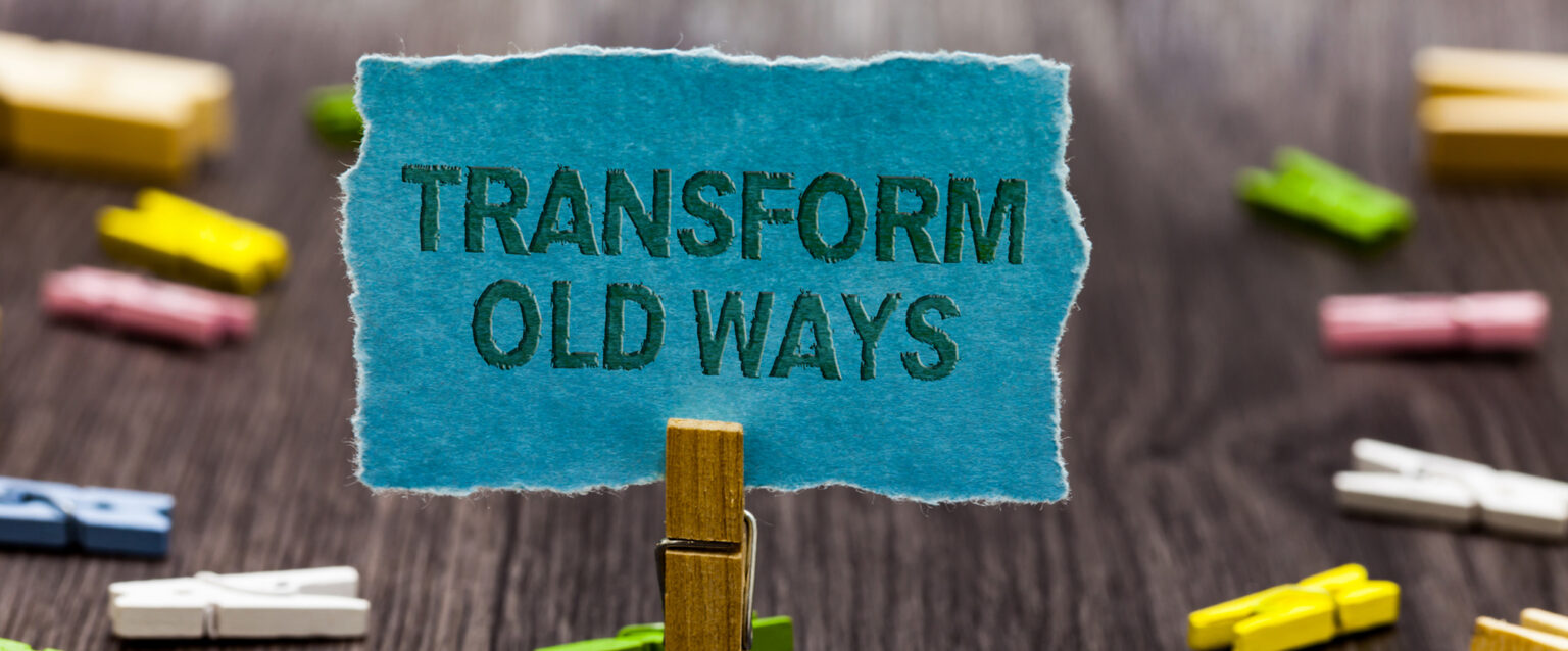 A blue scrap of paper held in a clothespin says Transform Old Ways (Image: Artur Szczybylo)