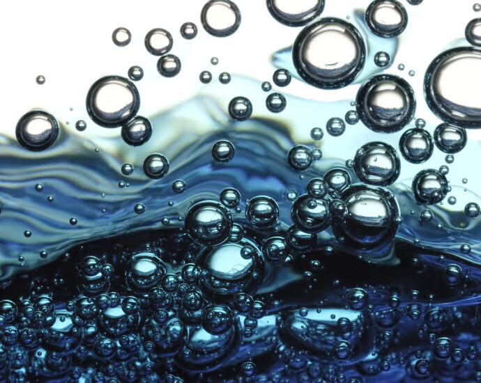 Surface bubbles in blue water.