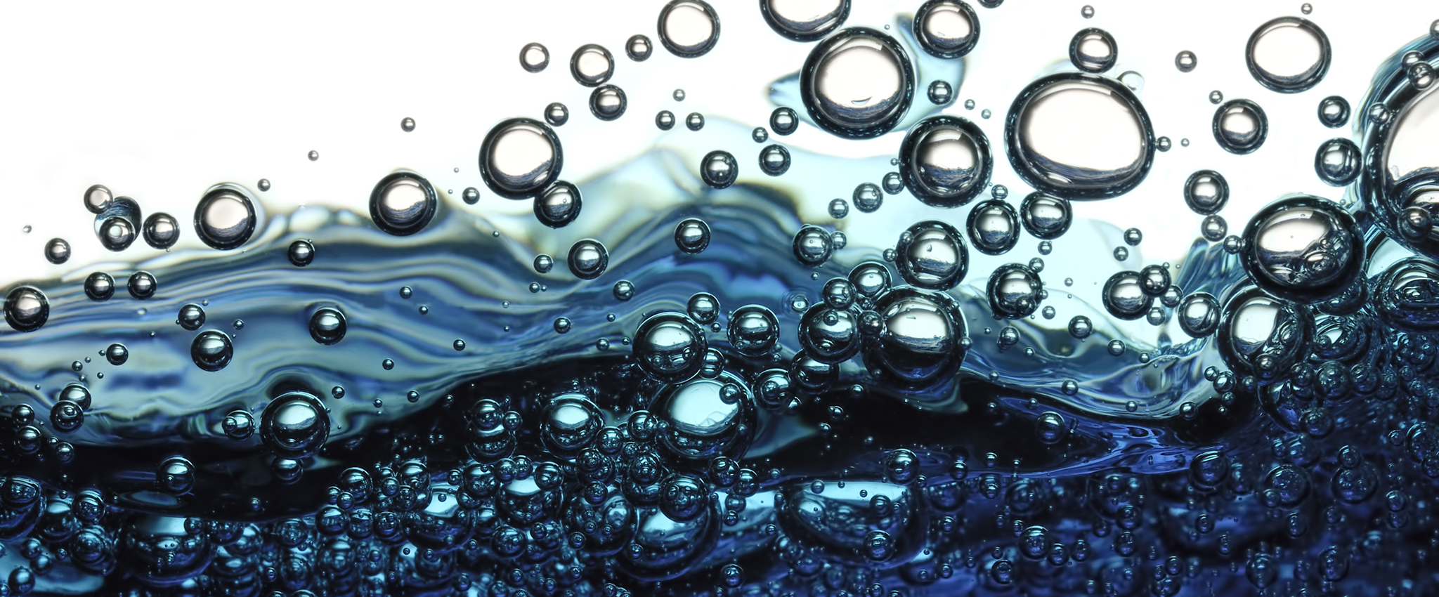 Surface bubbles in blue water.