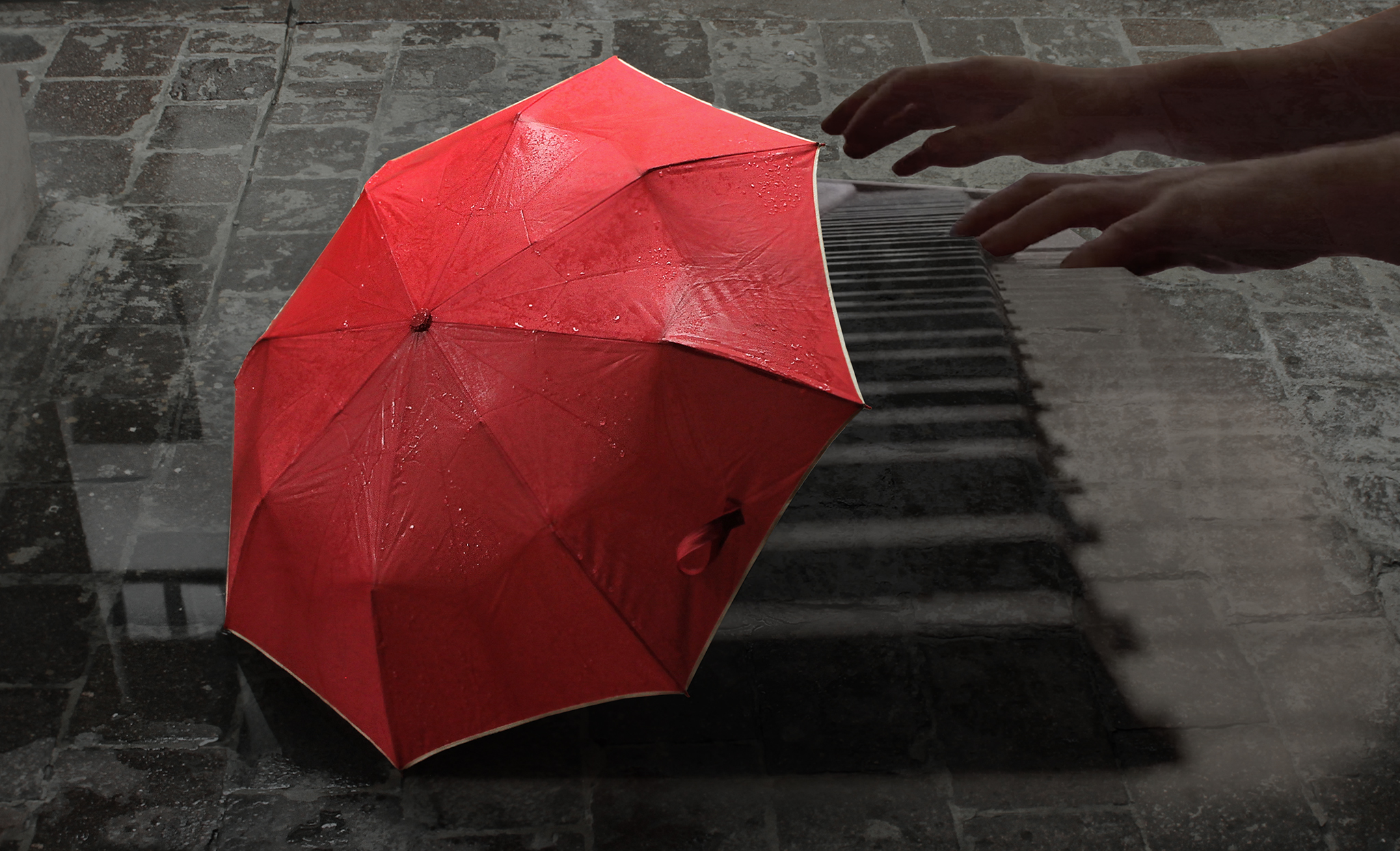 A bright red umbrella site alone on an aged European, wet, gray brick street. Overlay of pianist playing piano.