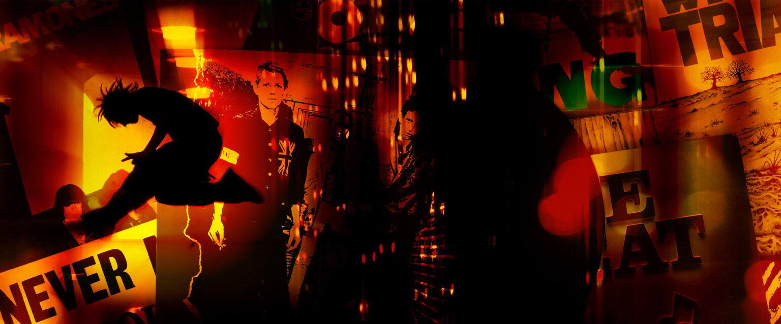 A photo composite of vintage punk vinyl album sleeves from the late 1970s and early 1980s, including Ramones, The Clash, Sex Pistols, The Fall, Savage Republic, and Dead Kennedys. The overlayed image contains the silhouette of a spike-haired punk rocker jumping with one leg in front and the other bent backward at the knee. Overall the finished piece is red, orange, yellow, and black with elements that obscure the LP art behind it.