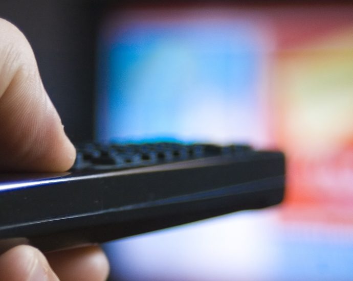 TV remote control. Searching through the channels.